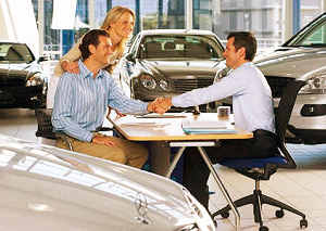 a young couple buying a car